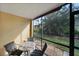 Relaxing screened patio overlooking a tranquil backyard at 25050 Sandhill Blvd # A4 Bldg 2, Punta Gorda, FL 33983