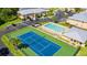 Aerial view of community pool and tennis court at 25050 Sandhill Blvd # A4 Bldg 2, Punta Gorda, FL 33983