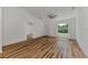 Open living room with hardwood floors and lots of natural light at 4637 Corbett Ln, North Port, FL 34288
