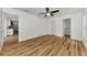 Bright bedroom with ceiling fan, wood flooring, and access to bathroom at 4637 Corbett Ln, North Port, FL 34288