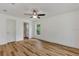 Spacious bedroom with ceiling fan and wood flooring at 4637 Corbett Ln, North Port, FL 34288