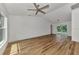 Spacious living area featuring light walls and wood flooring at 4637 Corbett Ln, North Port, FL 34288