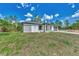 Newly built home with gray siding and a two-car garage at 4637 Corbett Ln, North Port, FL 34288