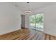 Dining area with hardwood floors and sliding glass doors at 4637 Corbett Ln, North Port, FL 34288