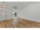 Living room with hardwood floors, neutral walls, and window at 4637 Corbett Ln, North Port, FL 34288