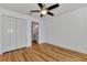 Bright bedroom with wood floors and double doors at 4637 Corbett Ln, North Port, FL 34288
