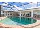 Large, refreshing pool with brick coping and screened enclosure at 374 Severin Se Rd, Port Charlotte, FL 33952