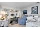 Living room with fireplace, comfortable seating and water views at 374 Severin Se Rd, Port Charlotte, FL 33952