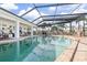 Expansive screened pool with brick deck and waterfront view at 374 Severin Se Rd, Port Charlotte, FL 33952