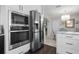 Updated kitchen featuring stainless steel appliances and white cabinets at 374 Severin Se Rd, Port Charlotte, FL 33952
