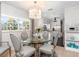 Bright dining area with glass table and kitchen view at 374 Severin Se Rd, Port Charlotte, FL 33952