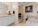 Elegant bathroom with soaking tub, walk-in shower, and updated vanity at 374 Severin Se Rd, Port Charlotte, FL 33952