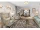 Open living space with comfortable armchairs and a view to the dining area at 374 Severin Se Rd, Port Charlotte, FL 33952