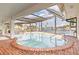 Inviting kidney-shaped pool with a screened enclosure at 374 Severin Se Rd, Port Charlotte, FL 33952