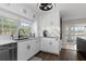 Modern white kitchen with stainless steel appliances and island at 374 Severin Se Rd, Port Charlotte, FL 33952