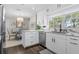 Modern kitchen with white cabinets and granite countertops at 374 Severin Se Rd, Port Charlotte, FL 33952