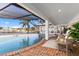 Inviting pool area with brick patio and water views at 374 Severin Se Rd, Port Charlotte, FL 33952