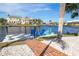 Private dock with blue Adirondack chairs and waterfront access at 374 Severin Se Rd, Port Charlotte, FL 33952