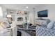 Living room featuring a fireplace, comfy seating, and large TV at 374 Severin Se Rd, Port Charlotte, FL 33952