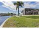 Large backyard with screened patio and access to the canal at 374 Severin Se Rd, Port Charlotte, FL 33952