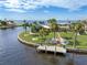 Waterfront home with a private dock and lush landscaping at 374 Severin Se Rd, Port Charlotte, FL 33952