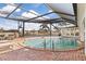 Refreshing screened pool with brick decking at 374 Severin Se Rd, Port Charlotte, FL 33952