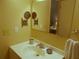 Bathroom with vanity and large mirror reflecting bedroom at 5505 Holiday Park Blvd, North Port, FL 34287
