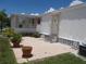 Front view of a white mobile home with patio at 5505 Holiday Park Blvd, North Port, FL 34287