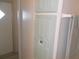 Bathroom with light teal cabinets and a shower/tub combo at 5505 Holiday Park Blvd, North Port, FL 34287