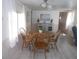 Bright dining area with round wooden table and four chairs at 5505 Holiday Park Blvd, North Port, FL 34287