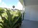 View of patio and lush landscaping at 5505 Holiday Park Blvd, North Port, FL 34287