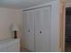 Bedroom with double door closet and dresser at 5505 Holiday Park Blvd, North Port, FL 34287