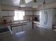 Spacious kitchen with ample counter space and white cabinets at 5505 Holiday Park Blvd, North Port, FL 34287