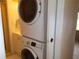 Laundry room with stacked washer and dryer at 5505 Holiday Park Blvd, North Port, FL 34287