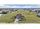 Aerial view of a single-Gathering home with a large yard and surrounding community at 17314 Cape Horn Blvd, Punta Gorda, FL 33955
