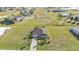Aerial view of single-Gathering home on a large lot with a paved driveway at 17314 Cape Horn Blvd, Punta Gorda, FL 33955