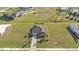 Aerial view of single-Gathering home on a large lot with a paved driveway at 17314 Cape Horn Blvd, Punta Gorda, FL 33955