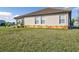 View of the house exterior, backyard, and a grassy area at 17314 Cape Horn Blvd, Punta Gorda, FL 33955
