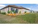 Large backyard with a grassy area and partial view of the community at 17314 Cape Horn Blvd, Punta Gorda, FL 33955