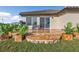 Relaxing patio with stone flooring and surrounding plants at 17314 Cape Horn Blvd, Punta Gorda, FL 33955