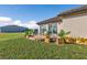 Landscaped patio with seating area, stonework, and planters at 17314 Cape Horn Blvd, Punta Gorda, FL 33955