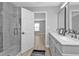 Elegant bathroom with double vanity, quartz countertop and a glass shower at 17314 Cape Horn Blvd, Punta Gorda, FL 33955