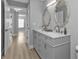 Modern bathroom with double vanity and decorative mirrors at 17314 Cape Horn Blvd, Punta Gorda, FL 33955