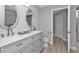 Updated bathroom with double vanity and a large mirror at 17314 Cape Horn Blvd, Punta Gorda, FL 33955