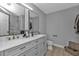 Modern bathroom with double vanity, quartz countertop and a glass shower at 17314 Cape Horn Blvd, Punta Gorda, FL 33955