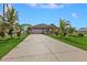 Long driveway leading to a one-story house at 17314 Cape Horn Blvd, Punta Gorda, FL 33955