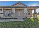 Front view of a single story home with a covered porch and landscaped yard at 17314 Cape Horn Blvd, Punta Gorda, FL 33955