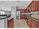 Modern kitchen with dark wood cabinets and granite countertops at 17314 Cape Horn Blvd, Punta Gorda, FL 33955