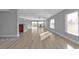 Bright and airy living room with light wood flooring and plenty of natural light at 17314 Cape Horn Blvd, Punta Gorda, FL 33955