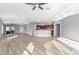 Spacious living room with light wood flooring and large windows at 17314 Cape Horn Blvd, Punta Gorda, FL 33955